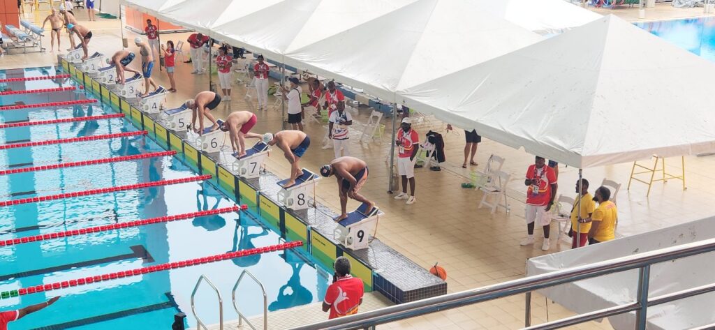 Swimmers on the starting blocks during a championship competition